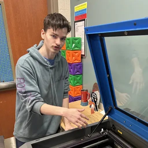 Dylan Kerezsi, giving an explanation in the on-campus engineering program at Ellet CLC.