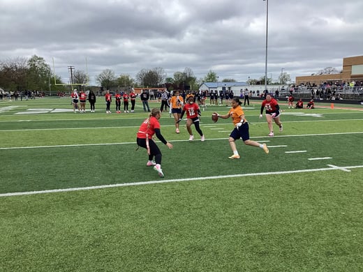 Lady Orangemen playing flag football at the Ellet Stadium.