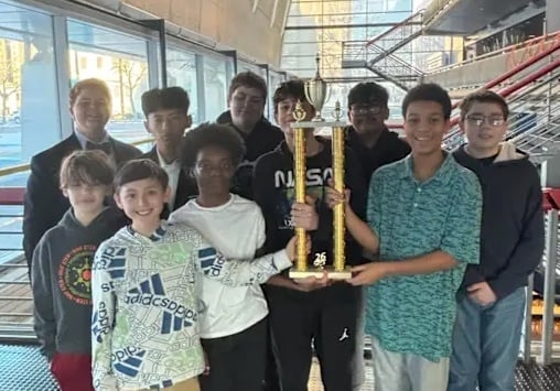 STEM Middle School chess team poses with their first place trophy after winning the Ohio Elementary State Championship in March.