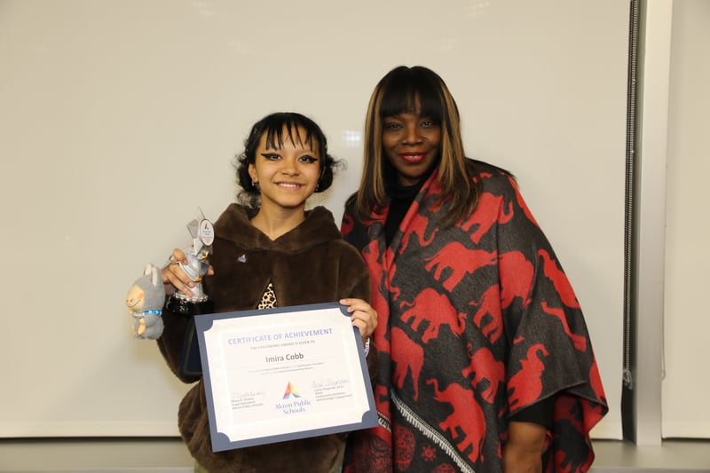 8th grade student and Spelling Bee champion, Irina, poses for a photo with Mary Outley after winning the 2026 Spelling Bee.